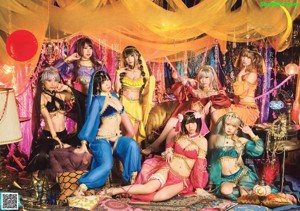 A woman in a blue and gold outfit posing for a picture.