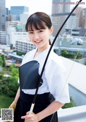 A woman in a kimono holding a sword on a magazine cover.