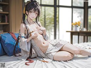 A woman in a white robe sitting on a bed.