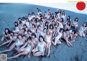 A group of women in a swimming pool posing for a picture.