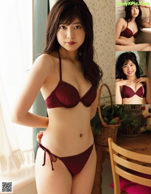 A woman in a red bikini posing on a bed.