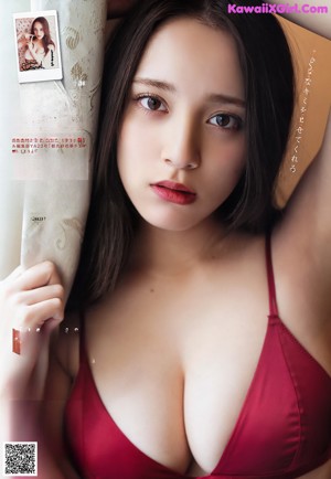 A woman in a white lingerie posing for a picture.