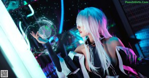 A woman with long white hair sitting in front of a neon sign.
